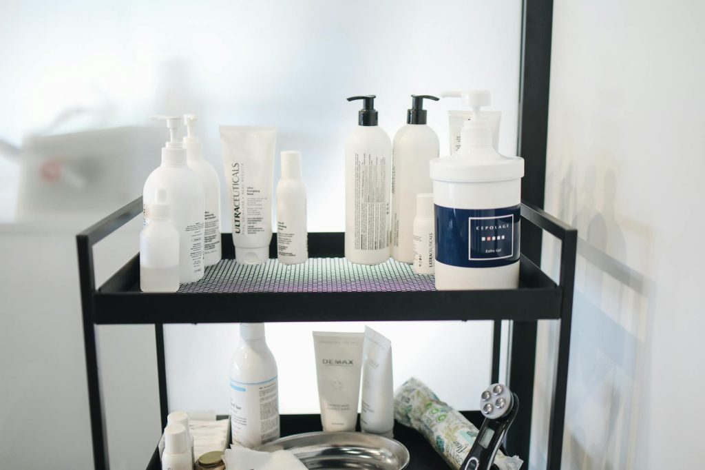 A chic arrangement of skincare products on a shelf at a beauty salon for professional use.