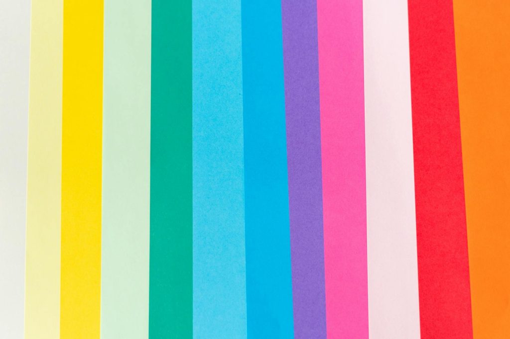 Top view of palette of vibrant colorful lines with different shades in row forming abstract background