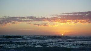 Mesmerizing sunset over the ocean waves at Destin Beach, Florida.