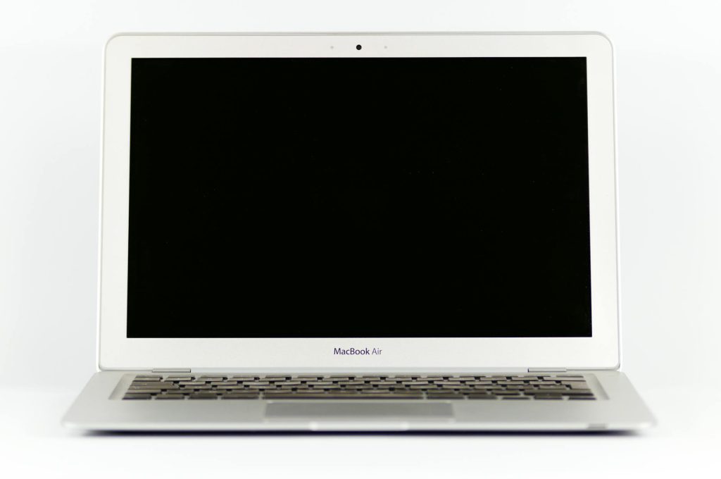 Front view of a MacBook Air laptop with a blank screen on a white background.