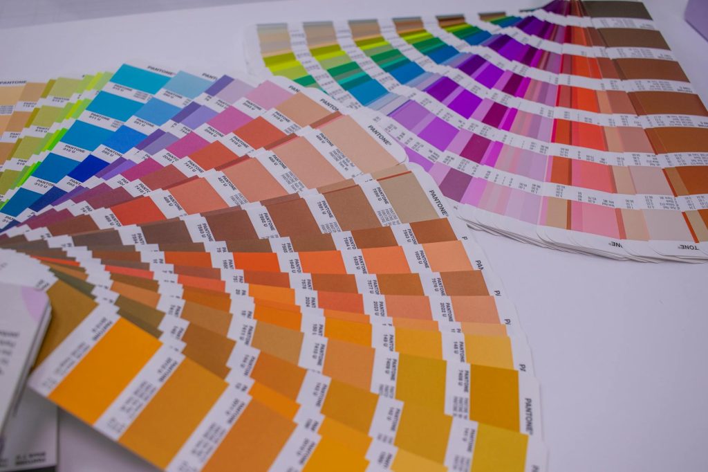 A collection of Pantone color swatches showcasing a wide range of vivid hues for designers.
