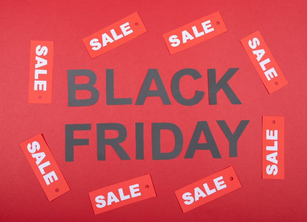Black Friday sale promotion with red tags on a red background. Ideal for advertising.