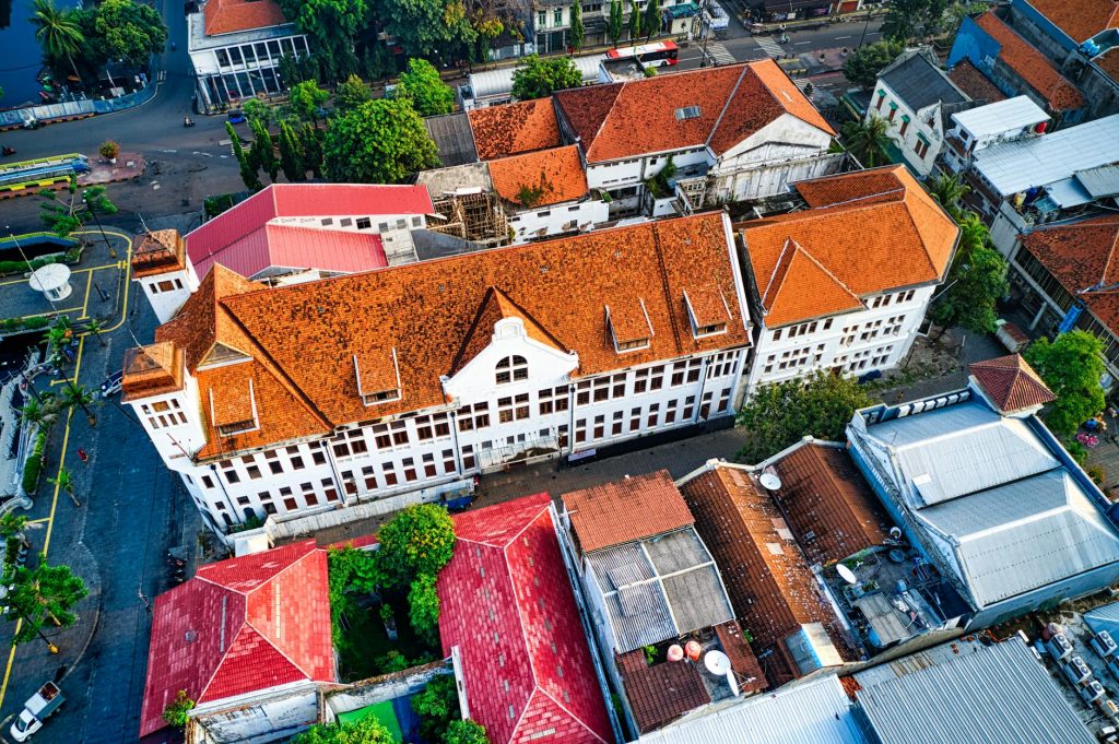 Stunning aerial view of vibrant rooftops in Jakarta, Indonesia, showcasing rich architectural details.