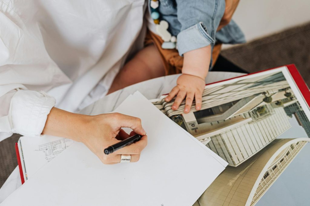 A mother and her child writing together at home, symbolizing family collaboration and creativity.