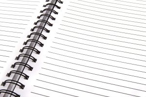 Open spiral notebook with lined pages, perfect for notes and planning.