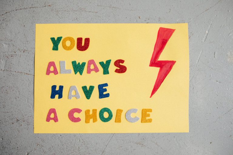Colorful handmade poster with inspiring message 'You Always Have a Choice' and red lightning bolt.