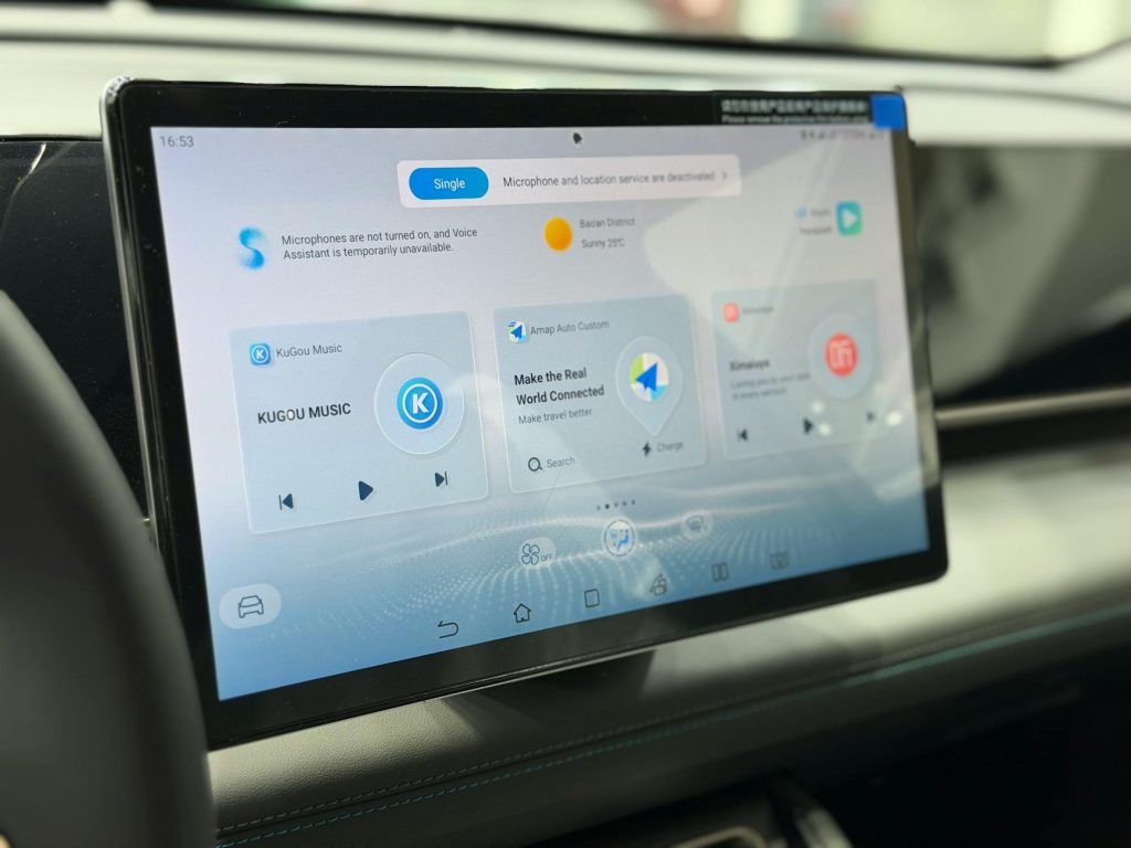 Modern car dashboard featuring a digital touchscreen interface with multiple apps.