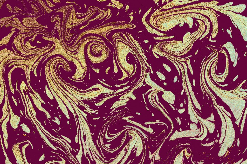 Dynamic abstract artwork featuring swirling maroon and gold patterns.