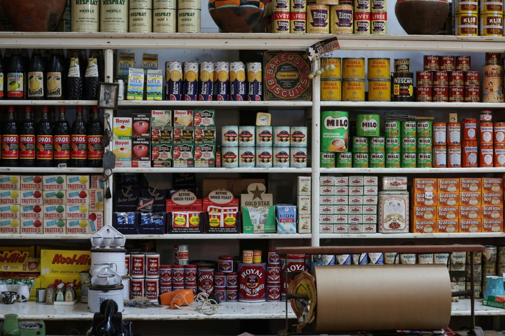 A vintage grocery store shelf filled with retro products and packaging from various brands.