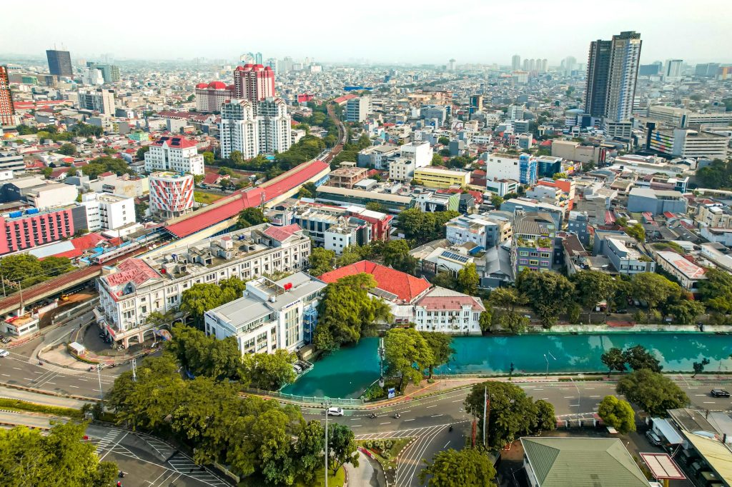 Explore Jakarta's historic Pasar Baru market area with this vibrant aerial view capturing its urban landscape.