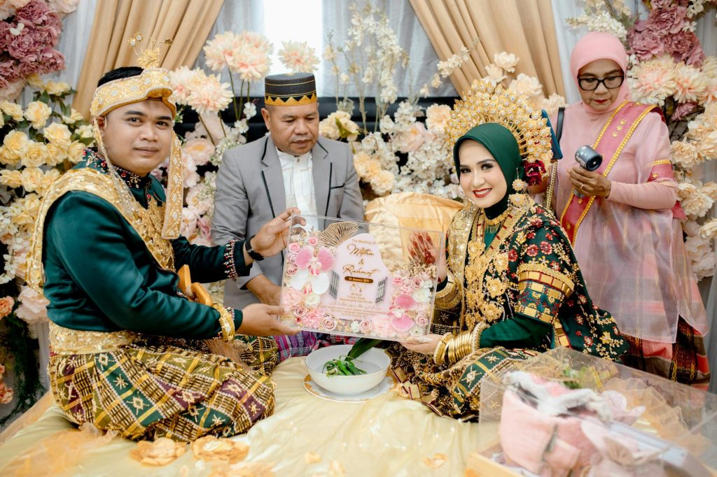A vibrant traditional wedding ceremony in South East Sulawesi, showcasing local attire and cultural practices.