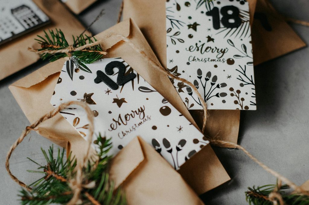 An elegant DIY Christmas advent calendar featuring paper bags and festive decorations.